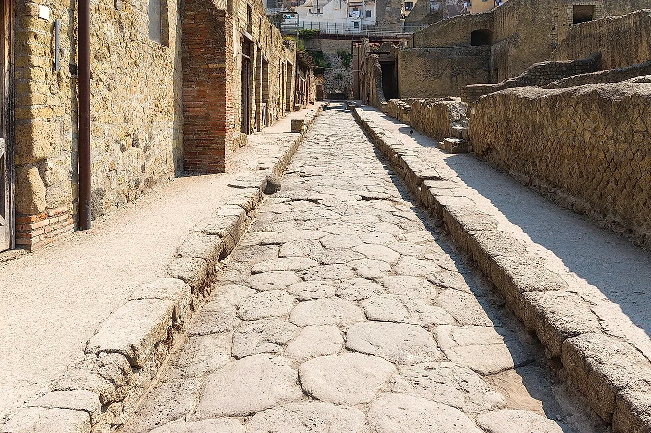Paved Roman street between houses at Herculaneum