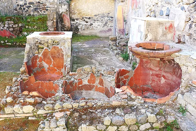 The red-painted jars of a Roman thermopolium, the ancient street-food counter