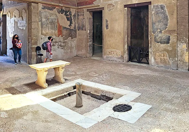 The atrium of the House of the Wooden Partition with its marble impluvium