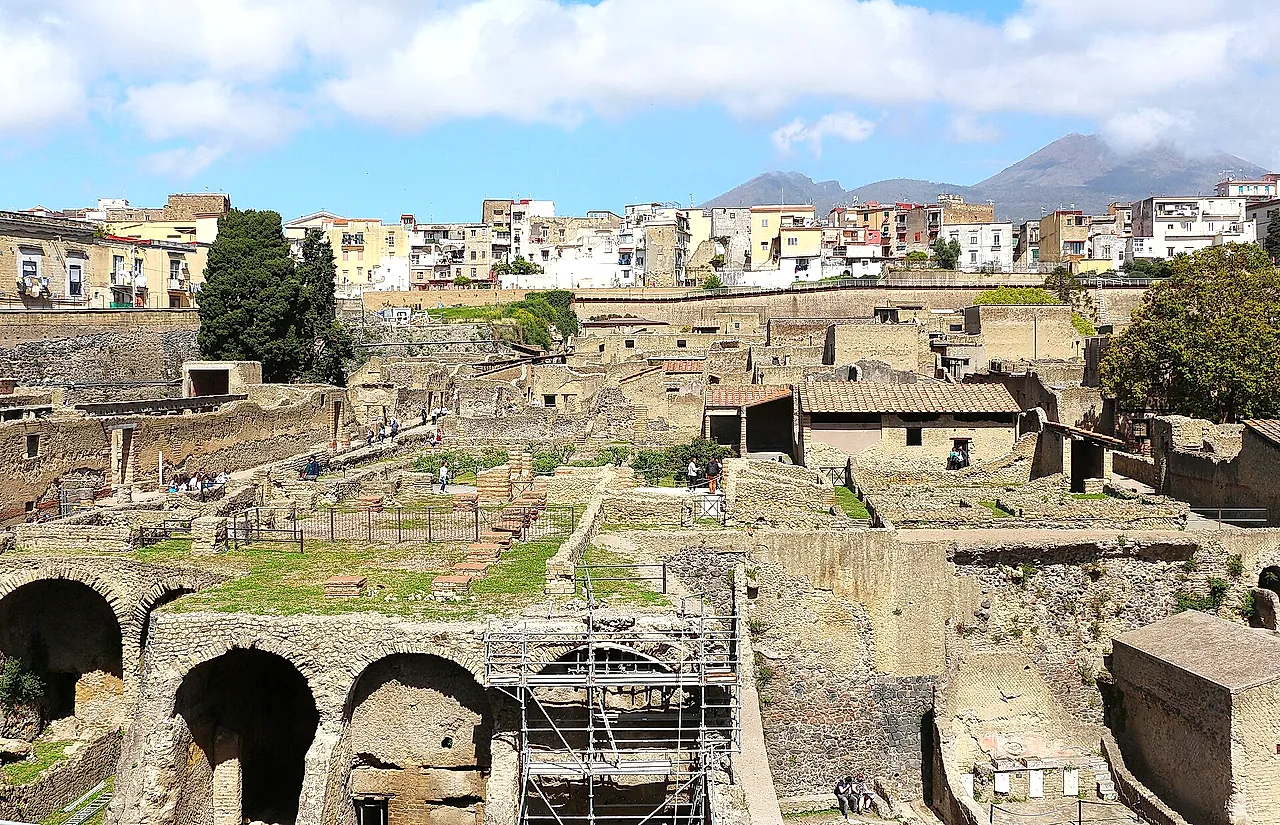 The excavated town of Herculaneum with the boathouse arches and Vesuvius beyond